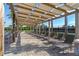 Relaxing poolside lounge area with shaded pergola and lounge chairs at 12128 Illustration Dr, Orlando, FL 32832