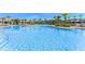 Large, refreshing community pool with plenty of lounge chairs at 12128 Illustration Dr, Orlando, FL 32832
