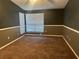 Large bedroom with dark walls and carpet at 1310 Stearman Ct # 4, Orlando, FL 32825