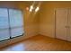 Simple dining room with wood floors and a window at 1310 Stearman Ct # 4, Orlando, FL 32825
