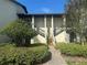 Inviting condo building entrance with lush landscaping and stairs at 1310 Stearman Ct # 4, Orlando, FL 32825