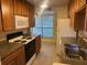 Kitchen with wood cabinets and stainless steel appliances at 1310 Stearman Ct # 4, Orlando, FL 32825