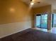 Living Room with carpet, sliding door to balcony and ceiling fan at 1310 Stearman Ct # 4, Orlando, FL 32825