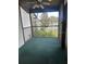 Screened patio overlooking a view of trees and tennis courts at 1310 Stearman Ct # 4, Orlando, FL 32825