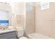 Clean bathroom with granite vanity, shower/tub combo, and neutral tile at 1784 Coriander Dr, Kissimmee, FL 34759