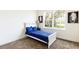 Cozy bedroom with a twin bed and large window at 1784 Coriander Dr, Kissimmee, FL 34759