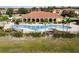 Community pool with clubhouse and surrounding landscape at 1784 Coriander Dr, Kissimmee, FL 34759