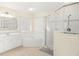 Main bathroom with corner tub, glass shower, and double sink vanity at 1855 S Lehigh Dr, Deltona, FL 32738