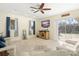 Bright living room with hardwood floors, a ceiling fan, and sliding glass doors at 1855 S Lehigh Dr, Deltona, FL 32738