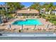Aerial view of pool, building, and grounds at 2 Escondido Cir # 190, Altamonte Springs, FL 32701
