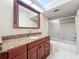 Bathroom with granite countertop vanity, large mirror, and shower/tub combo at 2 Escondido Cir # 190, Altamonte Springs, FL 32701