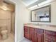 Main bathroom with granite vanity and shower at 2 Escondido Cir # 190, Altamonte Springs, FL 32701