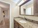 Bathroom with granite countertop vanity and a mirror at 2 Escondido Cir # 190, Altamonte Springs, FL 32701