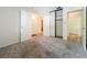 Bedroom with carpet, double door closet and access to hallway at 2 Escondido Cir # 190, Altamonte Springs, FL 32701