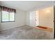 Bedroom with carpet flooring and access to hallway at 2 Escondido Cir # 190, Altamonte Springs, FL 32701