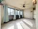 Bright enclosed patio, featuring tile floors and multiple windows at 2 Escondido Cir # 190, Altamonte Springs, FL 32701