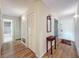 Light and bright entry hall with wood floors and white closets at 2 Escondido Cir # 190, Altamonte Springs, FL 32701
