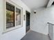 Condo entryway with grey door and window, featuring a white wall at 2 Escondido Cir # 190, Altamonte Springs, FL 32701
