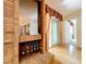 Brick fireplace with mirror and access to patio at 2 Escondido Cir # 190, Altamonte Springs, FL 32701