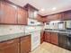 Modern kitchen with dark wood cabinets and granite counters at 2 Escondido Cir # 190, Altamonte Springs, FL 32701