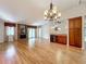 Bright living room with hardwood floors, fireplace, and wet bar at 2 Escondido Cir # 190, Altamonte Springs, FL 32701