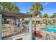Pergola with seating overlooking the pool at 2 Escondido Cir # 190, Altamonte Springs, FL 32701