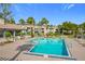 Community pool with lounge chairs and patio area at 2 Escondido Cir # 190, Altamonte Springs, FL 32701
