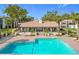 L-shaped pool with surrounding patio at 2 Escondido Cir # 190, Altamonte Springs, FL 32701
