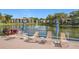 Relaxing poolside lounge chairs with lake views at 2 Escondido Cir # 190, Altamonte Springs, FL 32701
