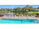 Relax by the pool with lake views and lounge chairs at 2 Escondido Cir # 190, Altamonte Springs, FL 32701