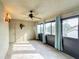 Bright sunroom with tile floors, windows, and ceiling fan at 2 Escondido Cir # 190, Altamonte Springs, FL 32701