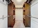 Spacious walk-in closet with custom built-in shelving and hanging rods at 2 Escondido Cir # 190, Altamonte Springs, FL 32701