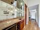 Home bar with granite countertop and wine rack at 2 Escondido Cir # 190, Altamonte Springs, FL 32701
