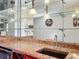 Wet bar with granite countertop and mirrored backsplash at 2 Escondido Cir # 190, Altamonte Springs, FL 32701
