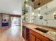 Wet bar with granite countertop and wine rack at 2 Escondido Cir # 190, Altamonte Springs, FL 32701