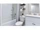 Clean bathroom with a shower/tub combo and white vanity at 2774 Puffin Pl, Davenport, FL 33837
