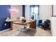 Modern home office with a large desk and comfortable chair at 2774 Puffin Pl, Davenport, FL 33837
