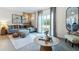 Relaxing living room, featuring a sectional sofa and coffee table at 2774 Puffin Pl, Davenport, FL 33837