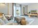 Living room with sectional sofa and access to patio at 2774 Puffin Pl, Davenport, FL 33837