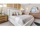 Bright main bedroom with a plush bed and stylish decor at 2774 Puffin Pl, Davenport, FL 33837