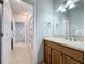 Clean bathroom with a shower, vanity, and tile flooring at 3301 Buckingham Way, St Cloud, FL 34772
