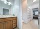 Well-lit bathroom with shower, toilet, and vanity at 3301 Buckingham Way, St Cloud, FL 34772