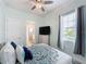 Bedroom with ensuite bathroom and window at 3301 Buckingham Way, St Cloud, FL 34772