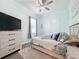 Bright bedroom with double doors and a ceiling fan at 3301 Buckingham Way, St Cloud, FL 34772