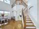 Elegant staircase with wrought iron railing leading to upper level at 3301 Buckingham Way, St Cloud, FL 34772