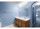 Double vanity bathroom with light wood cabinets and a large mirror at 3621 Ronda Dr, Deltona, FL 32738