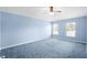 Light blue bedroom with carpeted floor and two windows at 3621 Ronda Dr, Deltona, FL 32738