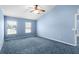 Spacious bedroom with light blue walls and carpeted floor at 3621 Ronda Dr, Deltona, FL 32738