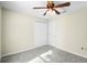 Spacious bedroom with double door closet and ceiling fan at 3621 Ronda Dr, Deltona, FL 32738