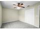 Bright bedroom with ceiling fan and closet at 3621 Ronda Dr, Deltona, FL 32738